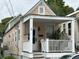 Charming home featuring a covered front porch with white railing and neutral exterior paint at 7 Dingle St, Charleston, SC 29403