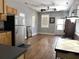 Bright, open living room with hardwood floors, neutral walls, and a view to the front door at 7 Dingle St, Charleston, SC 29403