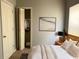 Cozy main bedroom with neutral walls, a closet, soft lighting and a modern art piece at 7 Dingle St, Charleston, SC 29403
