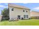 Lush backyard offering a patio, grill and space for recreation at 7644 High Maple Cir, North Charleston, SC 29418