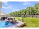 Expansive backyard with a playset, patio, and picnic table at 7644 High Maple Cir, North Charleston, SC 29418