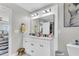 Bright bathroom featuring a dual sink vanity with modern fixtures and stylish decor at 7644 High Maple Cir, North Charleston, SC 29418