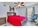 Comfortable bedroom with ceiling fan, large bed, and wood-look flooring at 7644 High Maple Cir, North Charleston, SC 29418