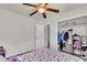 Bedroom featuring a ceiling fan and a closet with a clothes rack at 7644 High Maple Cir, North Charleston, SC 29418