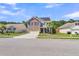 Beautiful two-story home with brick accents, solar panels, and well-kept lawn at 7644 High Maple Cir, North Charleston, SC 29418