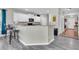 Well-designed kitchen features a breakfast bar, sleek flooring, and ample counter space for culinary enthusiasts at 7644 High Maple Cir, North Charleston, SC 29418