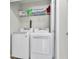 Well-organized laundry area with washer, dryer, and shelving at 7644 High Maple Cir, North Charleston, SC 29418