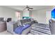 Open living area with gray sectional sofa and a workspace at 7644 High Maple Cir, North Charleston, SC 29418