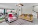 Spacious living room with gray wood floors and open to dining area and kitchen at 7644 High Maple Cir, North Charleston, SC 29418