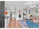 Bright living room features hardwood floors, modern decor, and an open layout flowing into the kitchen at 7644 High Maple Cir, North Charleston, SC 29418