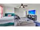 Inviting living area with bed, large couch, and entertainment area at 7644 High Maple Cir, North Charleston, SC 29418