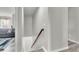 Interior staircase with white walls and a wood handrail at 7644 High Maple Cir, North Charleston, SC 29418
