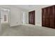 Neutral bedroom featuring carpet and closets with louvered doors allowing ample storage for comfortable living at 7950 Parklane Ct # C, North Charleston, SC 29418