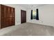 Neutral bedroom featuring carpet and closet with louvered doors allowing ample storage for comfortable living at 7950 Parklane Ct # C, North Charleston, SC 29418