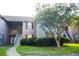 Charming exterior view of a multi-Gathering home with lush landscaping and mature trees at 7950 Parklane Ct # C, North Charleston, SC 29418