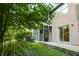 Condo backyard with patio, lake view, and screened in porch at 7950 Parklane Ct # C, North Charleston, SC 29418