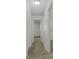 Bright hallway with neutral carpet and white trim, leading to multiple rooms at 7950 Parklane Ct # C, North Charleston, SC 29418