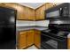 Galley kitchen featuring stainless steel appliances and wood cabinets at 7950 Parklane Ct # C, North Charleston, SC 29418