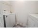 Well-lit laundry room with modern white washer and dryer at 7950 Parklane Ct # C, North Charleston, SC 29418