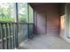 Relaxing screened patio with tile flooring and view to green landscape at 7950 Parklane Ct # C, North Charleston, SC 29418