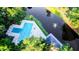 Aerial view of community pool and lake with water feature at 7950 Parklane Ct # C, North Charleston, SC 29418