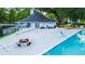 Community pool with picnic tables and lounging chairs at 7950 Parklane Ct # C, North Charleston, SC 29418