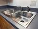 Large stainless steel double sink with chrome faucet and grey countertop at 7950 Parklane Ct # C, North Charleston, SC 29418