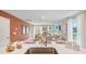 Open concept dining area with neutral finishes, natural lighting, and views into the living room at 8022 Rackham Rd, Hollywood, SC 29470