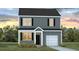 Charming two-story home with gray siding, black shutters, and a well-manicured lawn at 8026 Rackham Rd, Hollywood, SC 29470