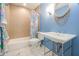 Stylish bathroom features blue walls, an oval mirror, and a charming shower curtain at 938 Sea Gull Dr, Mount Pleasant, SC 29464