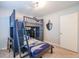 A bedroom featuring a sturdy bunk bed with built-in drawers and shelves for organization at 938 Sea Gull Dr, Mount Pleasant, SC 29464