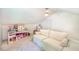 Bonus room offers flexible space with a cozy couch and room for a playroom or office setup at 938 Sea Gull Dr, Mount Pleasant, SC 29464