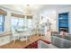 Bright and inviting dining area with a bench, round table, and modern light fixture at 938 Sea Gull Dr, Mount Pleasant, SC 29464
