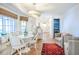 Bright dining area with a cozy bench, a round table, and a view into the kitchen at 938 Sea Gull Dr, Mount Pleasant, SC 29464