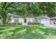 Charming single-story home with lush front yard and mature trees providing ample shade at 938 Sea Gull Dr, Mount Pleasant, SC 29464