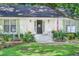 Charming home with a well-maintained lawn, inviting front porch, and patriotic American flag at 938 Sea Gull Dr, Mount Pleasant, SC 29464