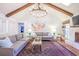 Living room with a high ceiling, skylight, beams, and a decorative fireplace at 938 Sea Gull Dr, Mount Pleasant, SC 29464
