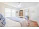 Spacious bedroom with stylish decor, hardwood floors, ceiling fan, and access to the ensuite bathroom at 938 Sea Gull Dr, Mount Pleasant, SC 29464