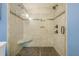 Modern walk-in shower features neutral-toned tilework, glass enclosure, a built-in bench, and dual shower heads at 938 Sea Gull Dr, Mount Pleasant, SC 29464