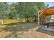 Spacious backyard includes a covered patio with grill and a shed for storage at 1004 Providence Way, Summerville, SC 29483