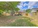 Fenced backyard includes a grill, play set, and a grassy lawn, ideal for Gathering fun at 1004 Providence Way, Summerville, SC 29483