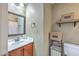 Cozy bathroom features a vanity with sink and decorative baskets and shelves at 1004 Providence Way, Summerville, SC 29483