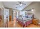 Bedroom with a vaulted ceiling, a ceiling fan, and access to another room through french doors at 1004 Providence Way, Summerville, SC 29483
