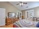 Primary bedroom with a vaulted ceiling, a ceiling fan, and a dresser with a large mirror at 1004 Providence Way, Summerville, SC 29483