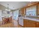 Bright eat-in kitchen area with a round table, a hanging light fixture, and access to the backyard at 1004 Providence Way, Summerville, SC 29483
