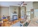 Inviting living room with a fireplace, comfortable seating, and views into dining area at 1004 Providence Way, Summerville, SC 29483