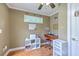 Functional home office space with a desk, natural light, and storage shelves at 1004 Providence Way, Summerville, SC 29483