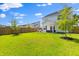 Expansive backyard with lush green grass, privacy fence, and covered patio offers space for outdoor entertaining at 101 Guernsey Ln, Summerville, SC 29483