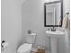 Powder room features modern fixtures, a pedestal sink, and a tiled floor at 101 Guernsey Ln, Summerville, SC 29483