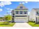 Charming two-story home with a white garage door and beautiful landscaping at 101 Guernsey Ln, Summerville, SC 29483